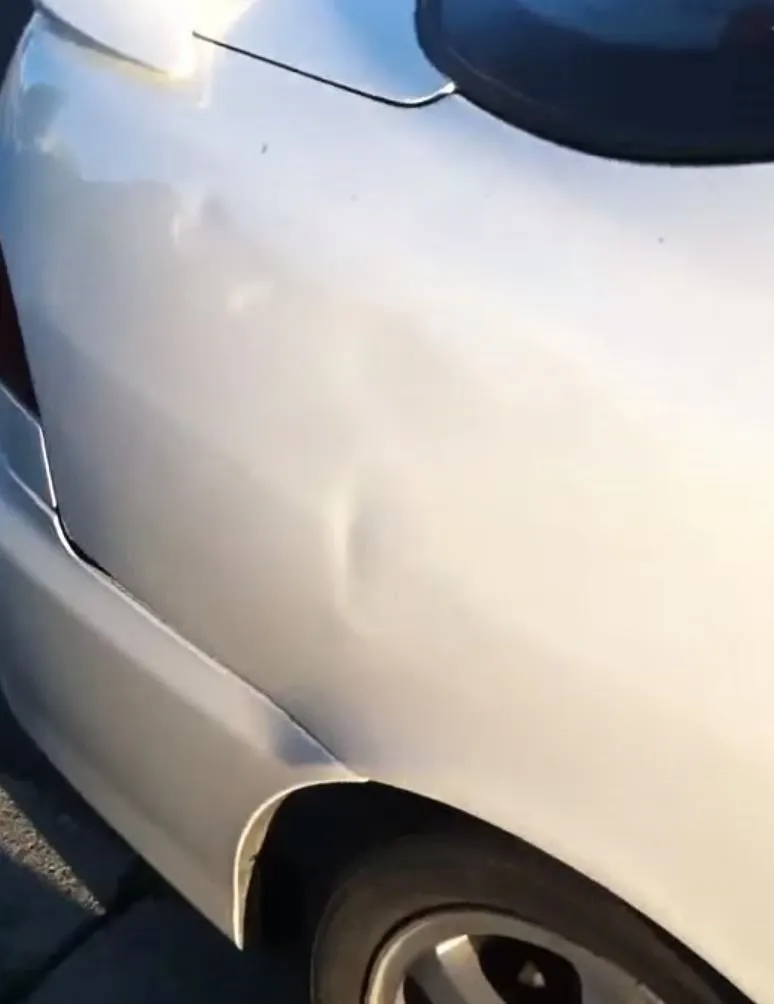 Image result for fixing a dent in a car with a plunger