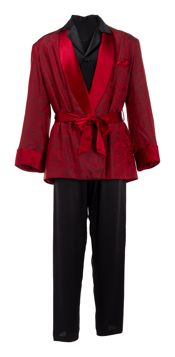 An ensemble consisting of Hugh Hefner's classic smoking jacket, silk pajamas, slippers and tobacco pipe