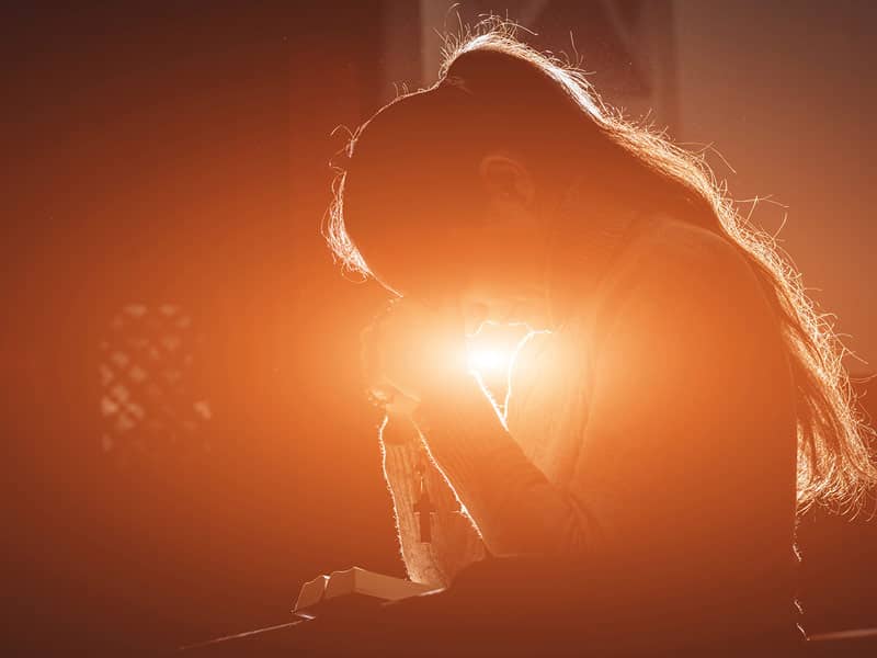 woman praying in church