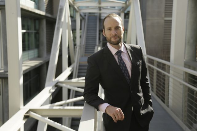 San Francisco District Attorney Chesa Boudin poses outside his office in San Francisco on Jan. 30, 2020. Boudin took office as district attorney in San Francisco a year ago as part of a politically progressive wave of prosecutors committed to seeking restorative justice over mass incarceration. But now the former …