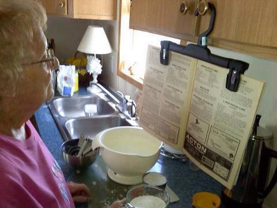 Had to share that my grandma does. Take a pants hanger and hang it on a cabinet in the kitchen to hold a cook book or any book and You have free hands to cook and look up if You forgot a step