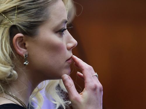 The actor Amber Heard waits before the jury, in the Depp v. Heard civil defamation trial at the Fairfax County Circuit Courthouse in Fairfax, Virginia, on June 1, 2022.