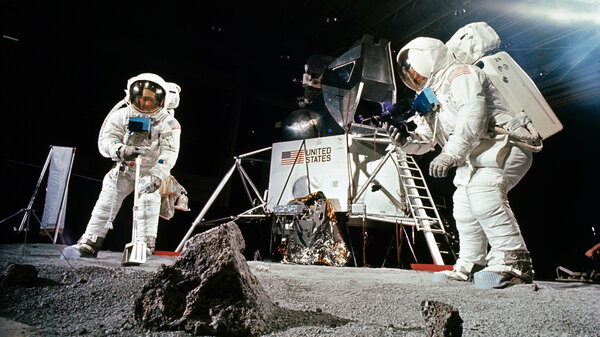 Buzz Aldrin (left) practices collecting a sample while Neil Armstrong photographs during a training session before the Apollo 11 mission. The Apollo 11 astronauts returned with about 50 pounds of material, including 50 rocks.