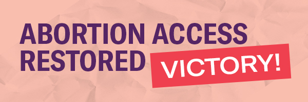 The word 'Victory!' in white font in a red rectangle and the words 'Abortion access restored' in puple font on a textured pink background.