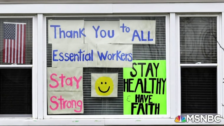 Health care workers read notes thanking them