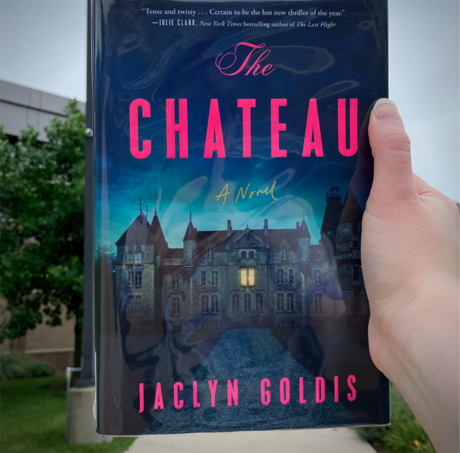 The book cover shows an imposing manor at the end of a long gravel drive The book cover shows an imposing manor at the end of a long gravel drive