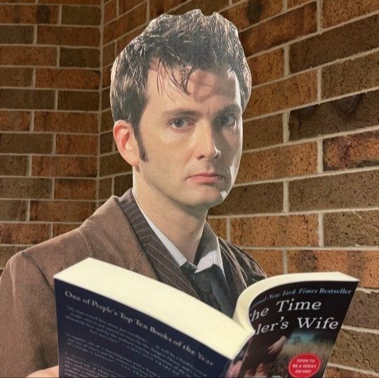 Carboard David Tennant reading The Time Traveler's Wife
