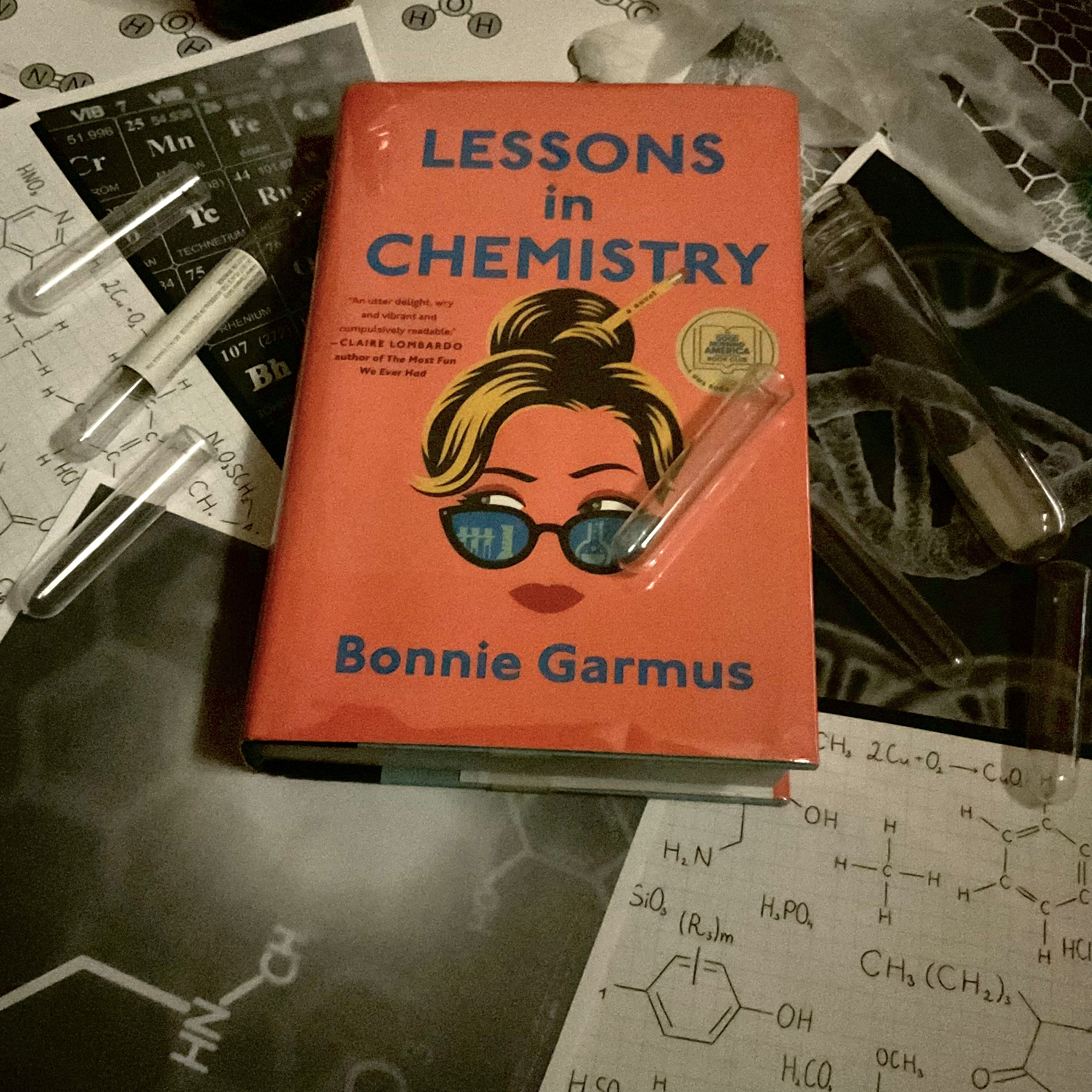 The book shows a woman's face with a pencil in her hair The book shows a woman's face with a pencil in her hair