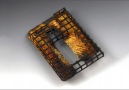 A striking metal brooch by Bette Barnett