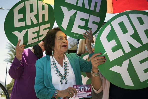 Dolores Huerta speaks to media outside Sinema’s office in Phoenix on Monday, Aug. 2.