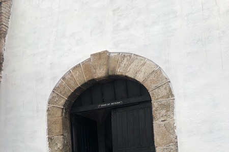 The castle's notorious Door of No Return—the last sight enslaved Africans saw before they boarded trading ships. It has since been renamed the Door of Return.