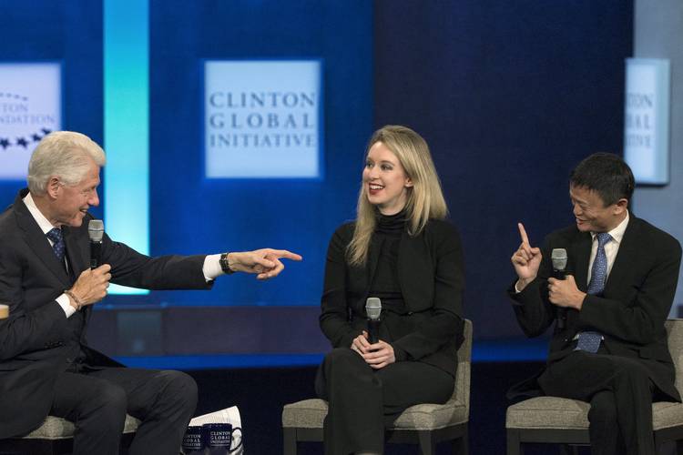 Bill Clinton speaks with Jack Ma, executive chairman of Alibaba Group, and Elizabeth Holmes, then CEO of Theranos. (Brendan McDermid/Reuters)