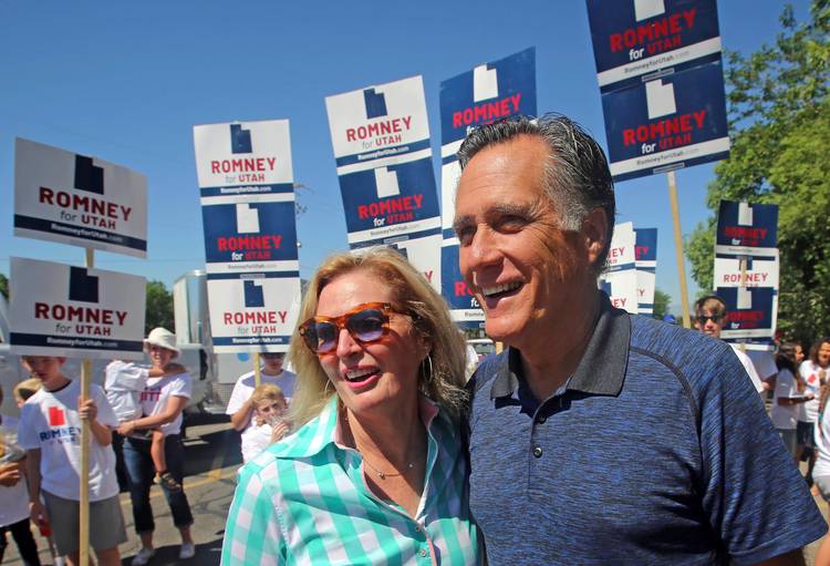 Mitt and Ann Romney walk in the Strawberry Day Parade Saturday in Pleasant Grove, Utah. (Rick Bowmer/AP)