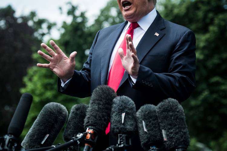President Trump stops to talk to members of the media as he walks from the Oval Office. (Jabin Botsford/The Washington Post)