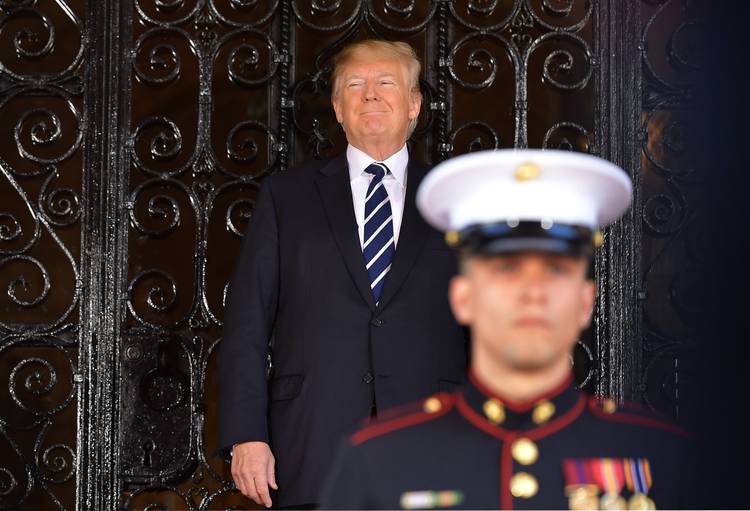 Donald Trump waits for the arrival of Japanese Prime Minister Shinzo Abe at Mar-a-Lago in Palm Beach on Tuesday. (Mandel Ngan/AFP/Getty Images)