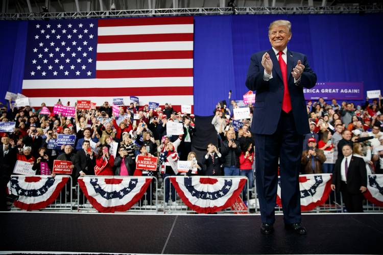 President Trump arrives for a campaign rally at the Atlantic Aviation in Moon Township, Pa., on Saturday night. (Carolyn Kaster/Associated Press)