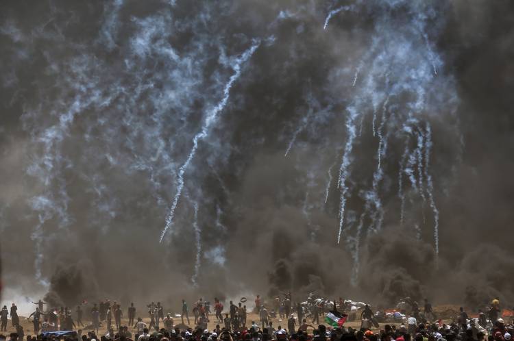 Israeli troops fire tear-gas and live ammunition on Palestinian protesters near the border with Israel. (Hathiam Imad/European Pressphoto Agency/Shutterstock)