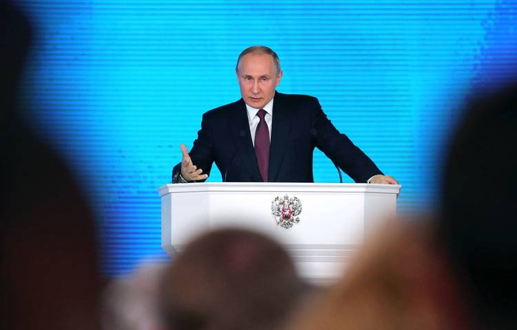 Vladimir Putin delivers his annual address to the Federal Assembly in Moscow. (Michael Klimentyev/Sputnik/Kremlin Pool/EPA-EFE/REX/Shutterstock)