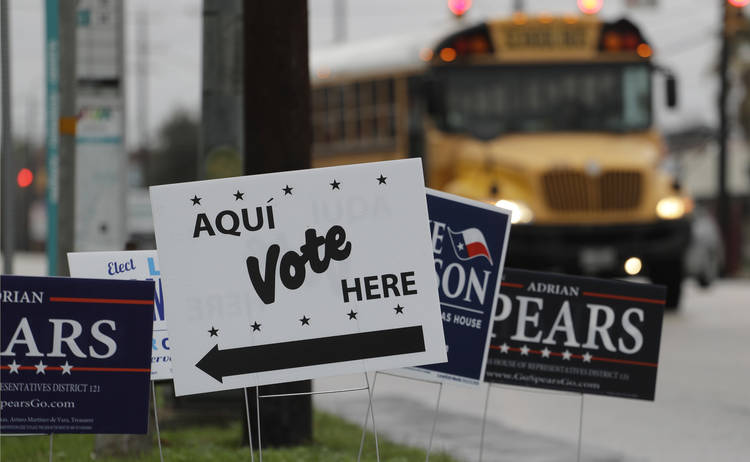 Signs point to an early voting location in San Antonio. (Eric Gay/AP)