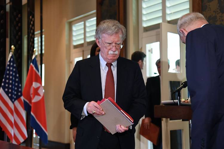 National security adviser John Bolton arrives for a signing ceremony between North Korean leader Kim Jong Un and President Trump in Singapore. (Saul Loeb/AFP/Getty Images)