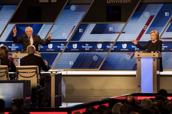 Clinton and Sanders in a 2016 debate. (Photo by Melina Mara/The Washington Post)