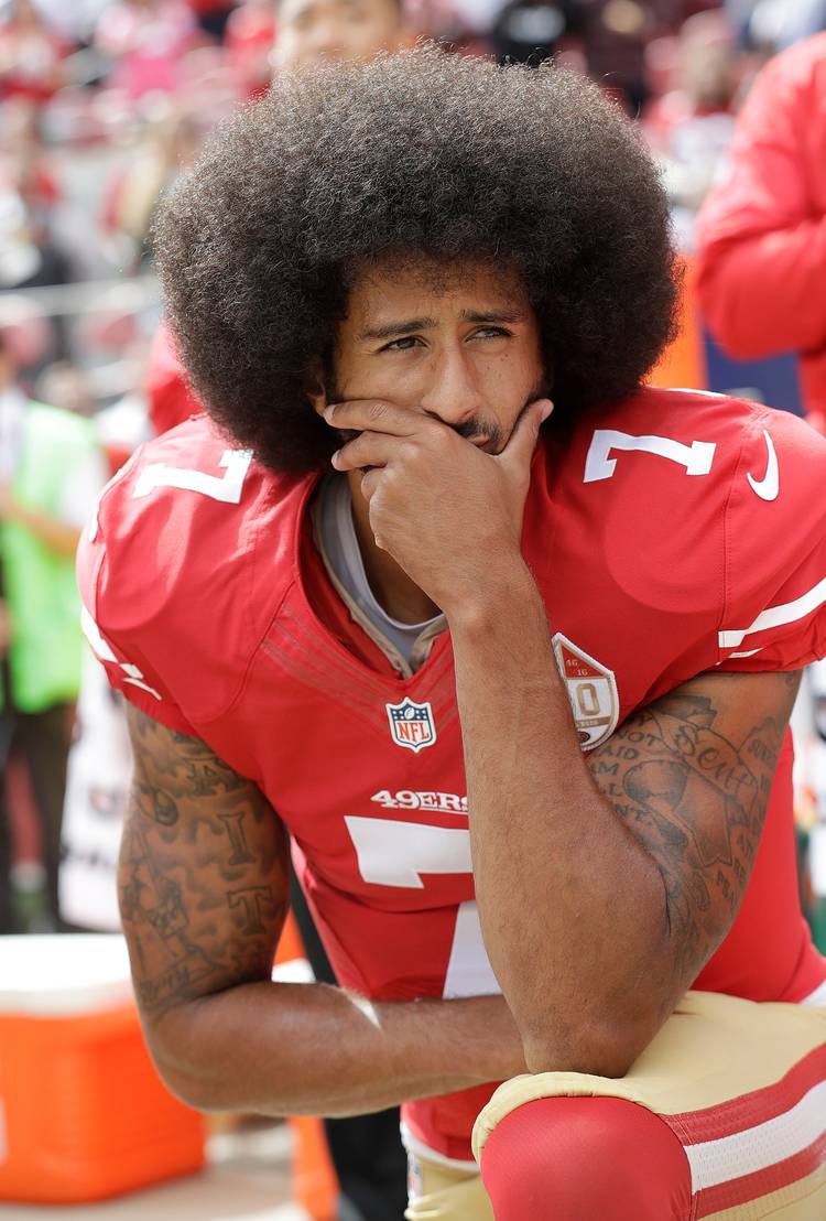 Then-San Francisco 49ers quarterback Colin Kaepernick kneels during the national anthem in 2016. (Marcio Jose Sanchez/AP)