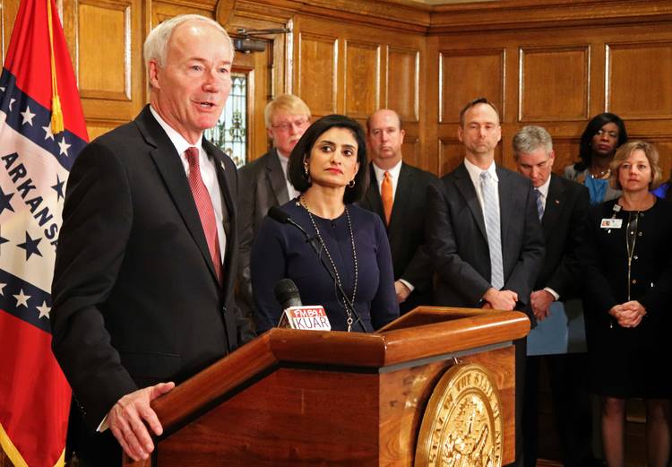 Arkansas Gov. Asa Hutchinson (R) speaks at a news conference with Seema Verma, the head of the Centers for Medicare and Medicaid Services. (Kelly P. Kissel/AP)