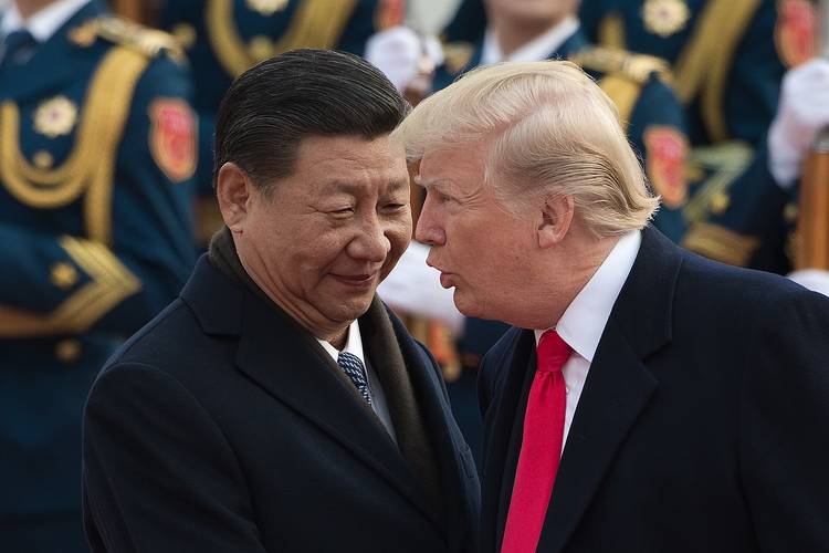 China's President Xi Jinping welcomes President Trump last November at the Great Hall of the People in Beijing. (Nicolas Asfouri/AFP/Getty Images)