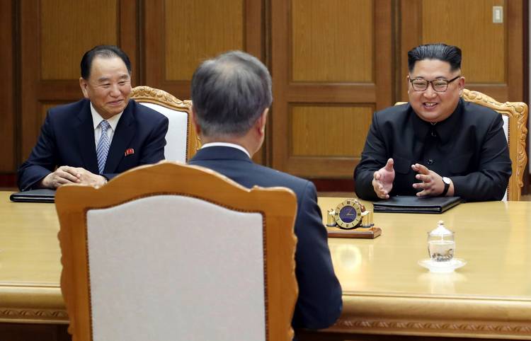 North Korean leader Kim Jong Un, right, talks with South Korean President Moon Jae-in. (South Korea Presidential Blue House/AP)