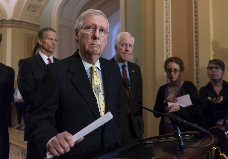 Senate Majority Leader Mitch McConnell, joined by Sen. John Thune (R-S.D.) and Majority Whip John Cornyn (R-Tex.), speaks to reporters on Capitol Hill. (J. Scott Applewhite/AP)