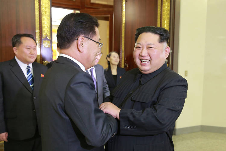 Kim Jong Un shakes hands with South Korean chief delegator Chung Eui-yong. (AFP/KCNA/KNS)