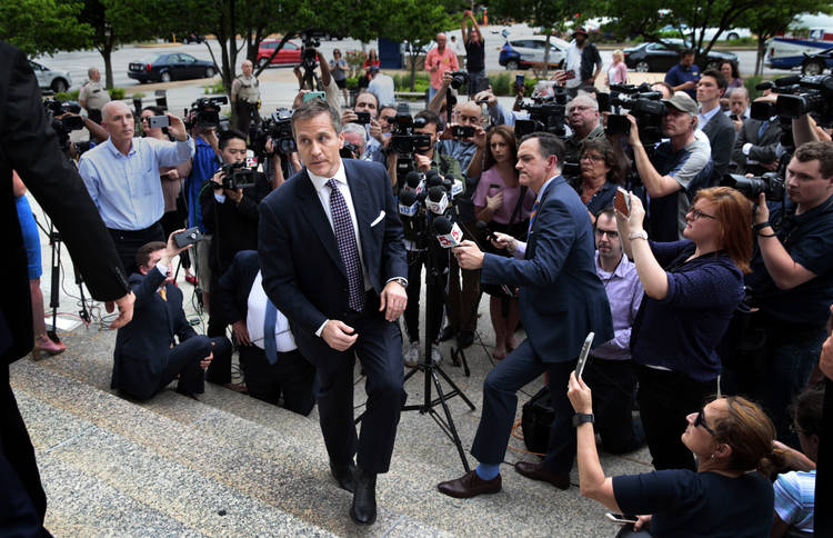 Missouri Gov. Eric Greitens (R) leaves the Civil Courts building Monday in St. Louis after prosecutors abruptly dropped a felony invasion-of-privacy charge alleging he took a revealing photo of a woman with whom he has acknowledged having an affair. (Robert Cohen/St. Louis Post-Dispatch/AP)