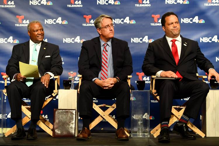 Democratic candidates for Maryland governor from left, Rushern L. Baker III, Richard S. Madaleno Jr., and Ben Jealous listen to the host before a candidates forum. (Katherine Frey/The Washington Post)
