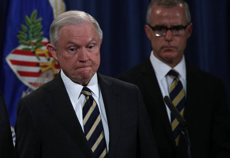 Attorney General Jeff Sessions and then-Acting FBI Director Andrew McCabe listen during a news conference last year. (Alex Wong/AFP/Getty Images)