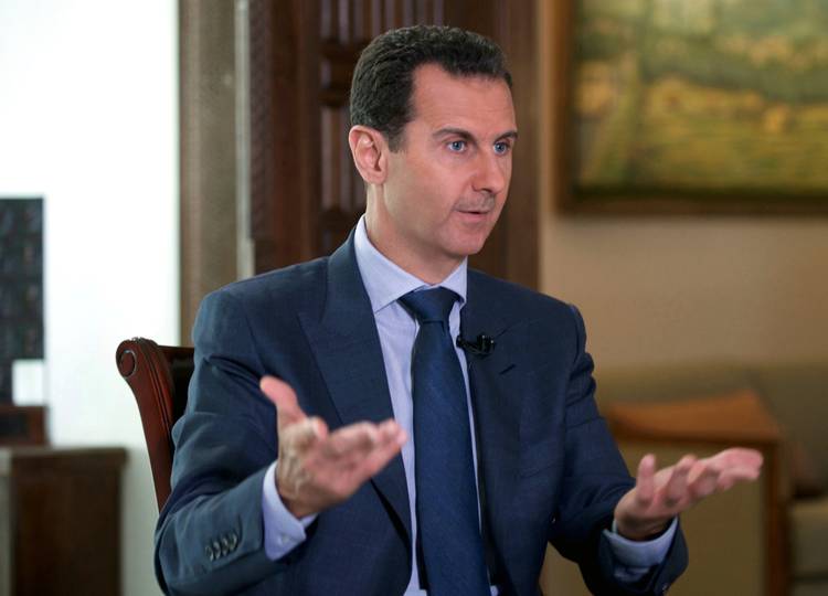 Syrian President Bashar Assad speaks to the Associated Press at the presidential palace in Damascus, Syria. (Syrian Presidency via AP, File)