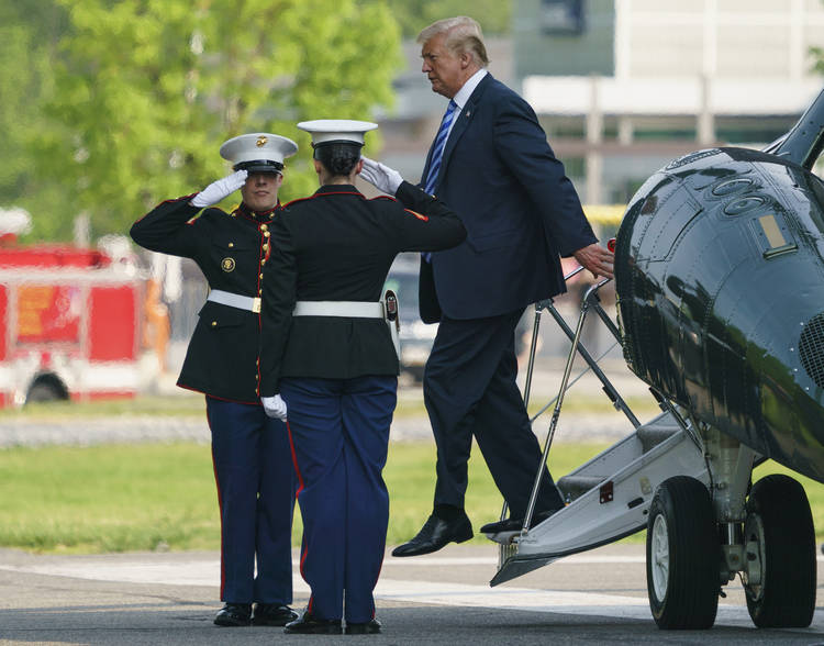 President Trump arrives on Marine One yesterday at Walter Reed National Military Medical Center in Bethesda, Md. (Carolyn Kaster/AP)