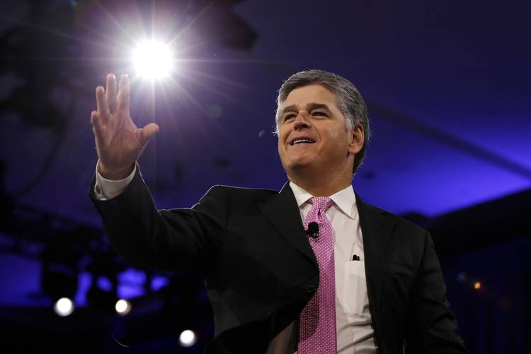 Sean Hannity of Fox News arrives on stage to speak with Reince Priebus during CPAC. (Carolyn Kaster/AP)