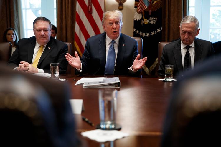 Secretary of State Mike Pompeo, left, and Defense Secretary Jim Mattis, right, listen as President Trump speaks during a Cabinet meeting. (Evan Vucci/AP)