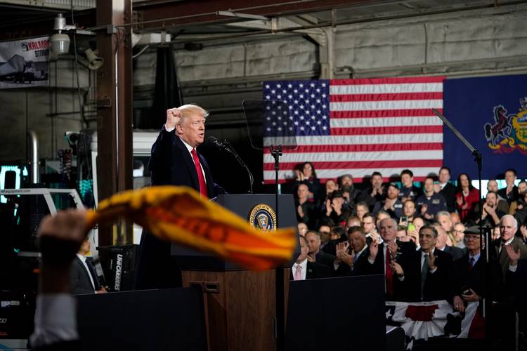 A supporter waves a “Terrible Towel” to show support for the Pittsburgh Steelers as President Trump speaks Jan. 18 at H&K Equipment in Coraopolis, Pa. (Mandel Ngan/AFP/Getty Images)