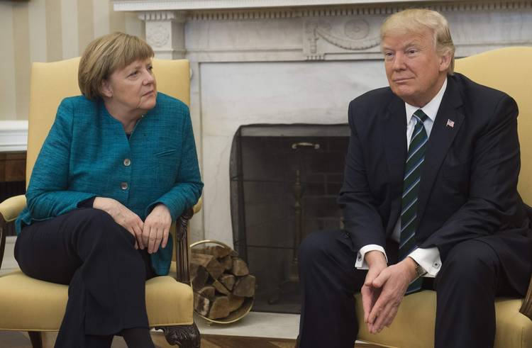 Trump and German Chancellor Angela Merkel meet in the Oval Office last year. (Saul Loeb/AFP/Getty Images)