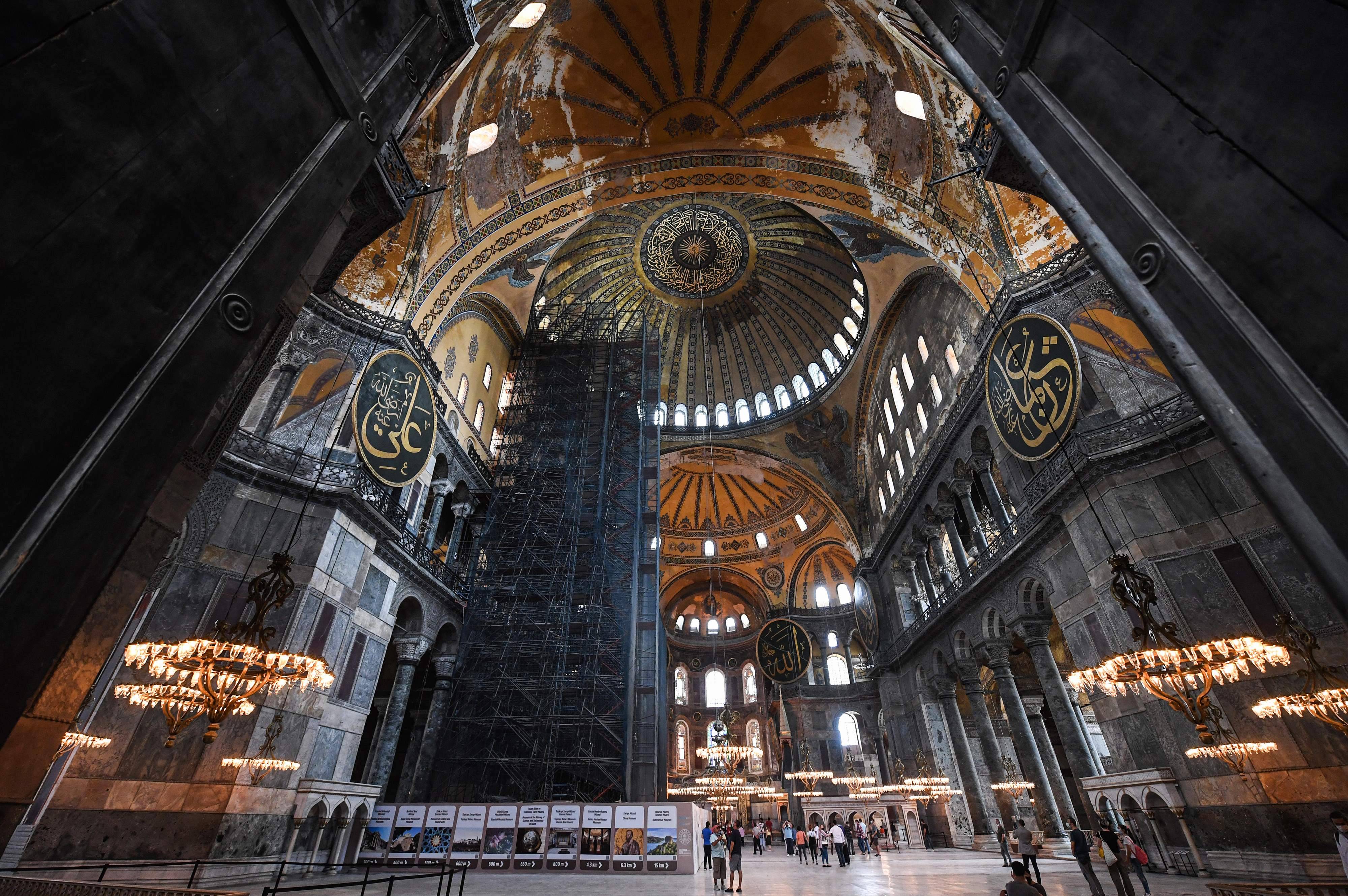 Tourists visit the Hagia Sophia in Istanbul on July 10. (Ozan Kose/AFP/Getty Images)