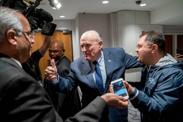 Rudy Giuliani leaves after speaking at the Iran Freedom Convention for Human Rights and Democracy. (Andrew Harnik/AP)