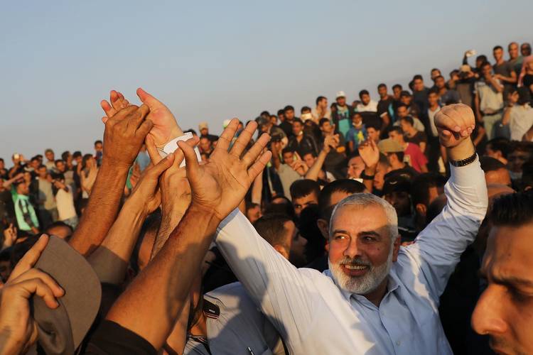 Hamas leader Ismail Haniya greets protesters at the border fence with Israel on May 15 in Gaza City. (Spencer Platt/Getty Images)