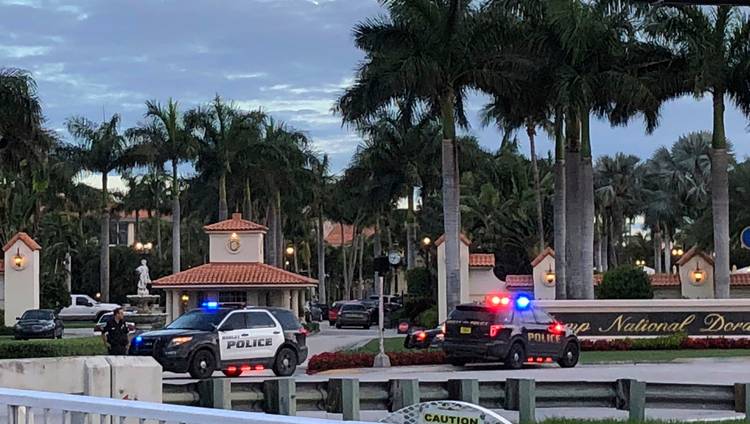 Police respond to the Trump National Doral resort after reports of a shooting Friday inside the Florida resort. (Frieda Frisaro/AP)