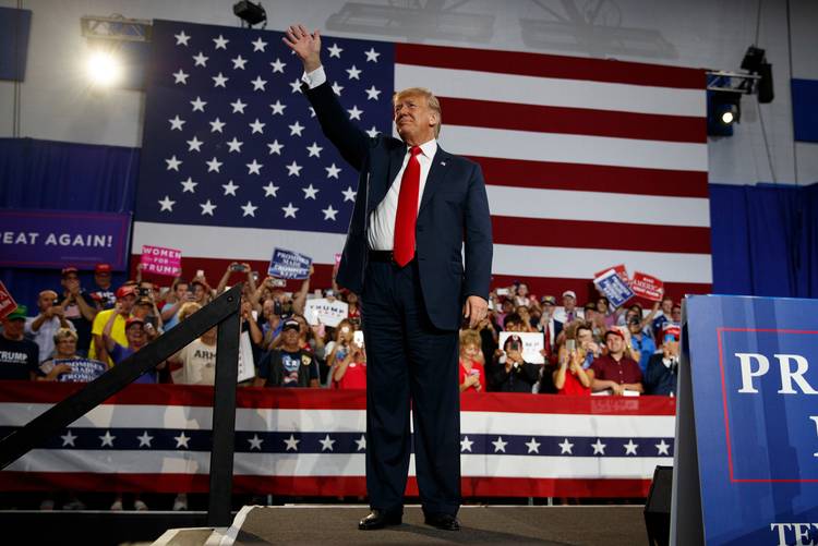 President Trump waves to the cheering crowd as he arrives to speak at a rally in Lewis Center, Ohio. (Carolyn Kaster/AP)
