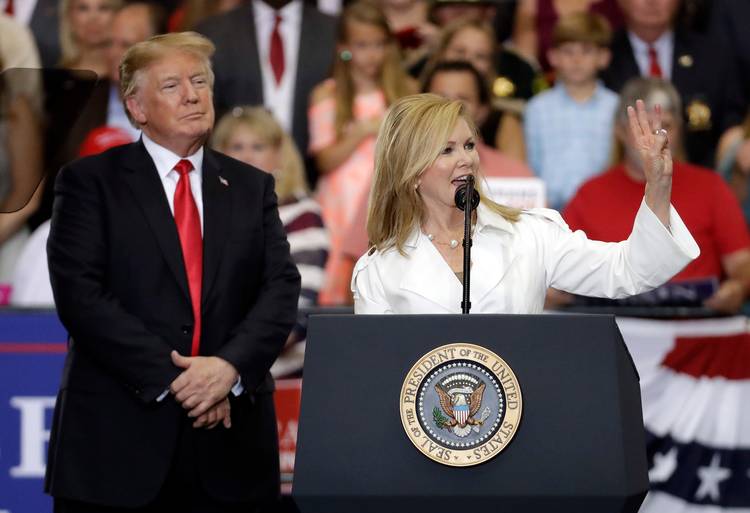 President Trump listens as Rep. Marsha Blackburn (R-Tenn.) speaks at a rally in Nashville. (Mark Humphrey/AP)