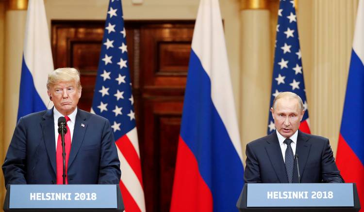 President Trump and Russian President Vladimir Putin hold a joint news conference after their meeting in Helsinki. (Grigory Dukor/Reuters)