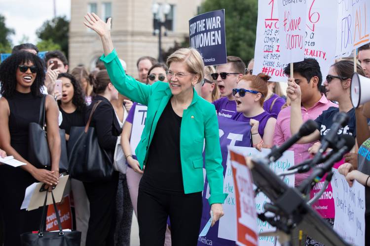 Sen. Elizabeth Warren (D-Mass.) joins activists at the Supreme Court last month. (J. Scott Applewhite/AP)