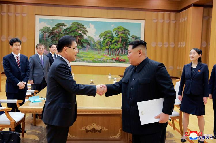 Kim Jong Un shakes hands with South Korean National Security Director Chung Eui-yong. (Korean Central News Agency/AP)