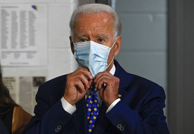 Joe Biden puts on a mask after a campaign event in Wilmington, Del. (Andrew Caballero-Reynolds/AFP/Getty Images)